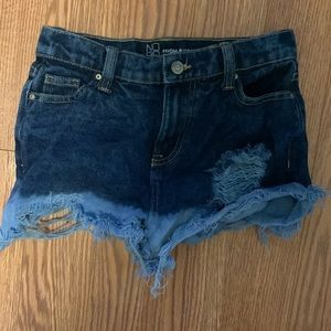 dark blue and light blue faded small ripped jeans shorts high rise
